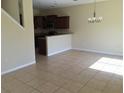 Bright dining room with tile floors and a view of the kitchen at 10975 Savannah Landing Cir, Orlando, FL 32832