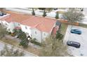 Aerial view of townhome with Spanish tile roof at 1230 Las Fuentes Dr, Kissimmee, FL 34746