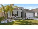 Curb appeal abounds in this one-story home with a landscaped front yard at 2022 Canton Park Dr, Winter Haven, FL 33881