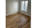 Bright bedroom with light wood laminate flooring at 2210 Stonington Ave # 2210, Orlando, FL 32817