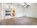 Spacious living room with tile and carpet flooring, and ceiling fans at 2752 Sedgefield Ave, Deltona, FL 32725