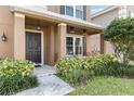 Inviting front porch with two metal chairs and lush landscaping at 3969 Lone Eagle Pl, Sanford, FL 32771