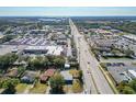 Aerial view showing home's location near a main road and businesses at 4400 Southmore Dr, Orlando, FL 32812