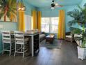 Bright living room with tropical decor, wooden floors, and comfy seating at 4560 Yellowgold E Rd # 108, Kissimmee, FL 34746