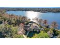 Aerial view showcasing a lakefront home with expansive lake views at 491 Carolyn Dr, Oviedo, FL 32765