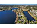 Aerial view of lakefront community with various homes at 491 Carolyn Dr, Oviedo, FL 32765