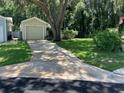 Single car garage with driveway and landscaping at 505 Harvard Pl, Apopka, FL 32703