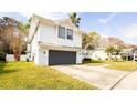 A bright white house with a grey two-car garage, set on a green lawn at 862 Shriver Cir, Lake Mary, FL 32746