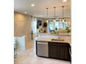 Open kitchen with island, stainless steel appliances, and granite countertops at 1100 Pavia Dr, Apopka, FL 32703