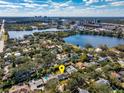 House's aerial view showing its location near a lake and city at 1102 Wilkinson St, Orlando, FL 32803