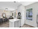 Modern kitchen with white cabinets, stainless steel appliances, and an island at 14531 Clarkson Dr, Orlando, FL 32828