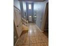 Bright entryway with high ceilings, tile floors, and staircase at 1662 Lima Ave, Kissimmee, FL 34747