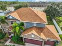 Top-down view of a large two-story house with brown roof at 2125 Tybee Rd, St Cloud, FL 34769