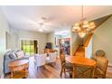 Inviting living room featuring wood floors, stylish furnishings, and sliding glass doors for natural light at 3632 Calabria Ave, Davenport, FL 33897