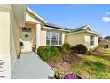 Landscaped front yard with walkway leading to house entrance at 5504 Hamlin Close Rd, Davenport, FL 33896