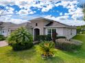 Well-maintained house with attractive landscaping and palm trees at 754 San Joaquin Rd, Kissimmee, FL 34759