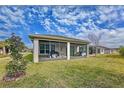 Spacious screened-in patio with outdoor furniture and grill at 754 San Joaquin Rd, Kissimmee, FL 34759