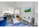 Bright living room with open-concept design, modern decor, and seamless flow to dining at 103 Rum Run # 103, Davenport, FL 33837