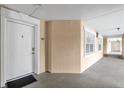 Building hallway with neutral colored walls and white doors at 1358 Centre Court Ridge Dr # 202, Reunion, FL 34747