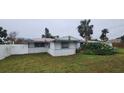 Rear view of the house showing a large backyard at 167 Benjamin Dr, Ormond Beach, FL 32176