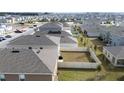 Aerial view showcasing a home's backyard and privacy fence at 2630 Angel Falls Dr, Davenport, FL 33837