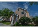 Exterior view of charming light pink house with porch at 3013 Bonfire Beach Dr # 101, Kissimmee, FL 34746