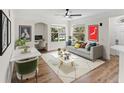 Bright living room with a comfortable seating area and a dedicated workspace with built in desk at 3013 Bonfire Beach Dr # 101, Kissimmee, FL 34746