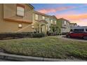 Evening view of townhome community with well-maintained landscaping at 346 Monroe Cir, Davenport, FL 33896