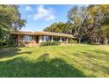 Ranch-style home with large yard and mature trees at 4135 Chuluota Rd, Orlando, FL 32820