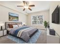 Bright bedroom featuring a comfortable bed and large window at 4876 Conway Rd # 96, Orlando, FL 32812