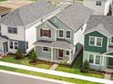 An aerial view of the house showcasing the landscaping, exterior colors and roof at 520 Orient Ave, Debary, FL 32713