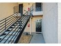 Condo building entrance with stairs leading to multiple units at 670 Sandy Neck Ln # 103, Altamonte Springs, FL 32714