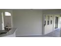 Bright open-concept living space featuring access to a patio via sliding glass doors at 11618 Grand Bay Blvd, Clermont, FL 34711
