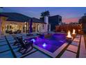 Backyard pool with fire bowls, an integrated spa, lounge chairs, and stylish concrete pavers at 10416 Pocket Ln, Orlando, FL 32836