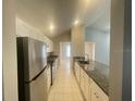 Bright kitchen featuring granite countertops and stainless steel appliances at 12703 Whiterapids Dr, Orlando, FL 32828