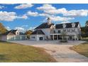 Spacious home with detached garage and a long driveway, set on a sprawling green lawn at 1730 Connecticut Ave, St Cloud, FL 34769