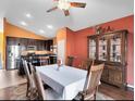Dining room with wood floors, a large table, and access to the backyard at 290 Clydesdale Cir, Sanford, FL 32773