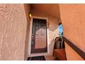 Warm and inviting front door with charming decor, a cute welcome mat and a secure lock at 2935 Antique Oaks Cir # 64, Winter Park, FL 32792