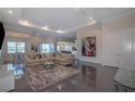Cozy living room with a large sectional sofa, plush rug, and recessed lighting at 4731 Clock Tower Dr # 401, Kissimmee, FL 34746