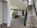View of an entryway with stairs leading upstairs and boxes indicating new construction at 5306 Center Lake Ranch Blvd, St Cloud, FL 34771