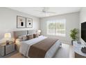 Well-lit bedroom featuring a neutral palette, large window, and minimalist decor for a serene space at 5413 Hansel Ave # K10, Orlando, FL 32809