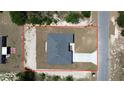 Aerial view of a neatly-kept property with clean lines and a spacious lot outlined in red at 6618 Sw 128Th Pl, Ocala, FL 34473
