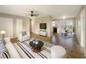 Bright living room features tile floors and open concept layout at 1490 Lake Opal Dr, Apopka, FL 32703