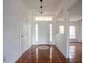 Bright and airy entryway with tile flooring and access to other rooms at 1717 Minnow Ct, Poinciana, FL 34759