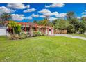 Ranch style home with spacious lawn and mature trees at 2808 Touraine Ave, Orlando, FL 32812