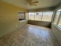 Bright sun room with tile floors and multiple windows, perfect for relaxing and enjoying the outdoors at 3303 Jon Jon Dr, Orlando, FL 32822