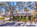 House exterior showcasing a ranch-style home with landscaping at 400 Magnolia Oak Dr, Longwood, FL 32779