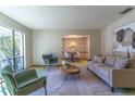 Spacious living room featuring a neutral sofa and armchairs at 400 Magnolia Oak Dr, Longwood, FL 32779