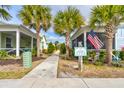 Neat walkway through a community of charming beach cottages at 421 High Tide Ln, Daytona Beach, FL 32124