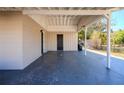 Spacious carport offering shelter and convenient access with an adjacent storage area at 5112 Londonderry Blvd, Orlando, FL 32808